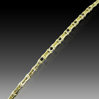 Bracelet articulé en or jaune 18 Cts avec Diamants et Saphirs