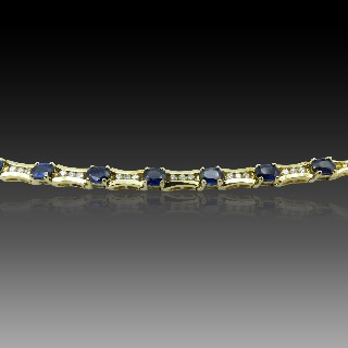 Bracelet articulé en or jaune 18 Cts avec Diamants et Saphirs