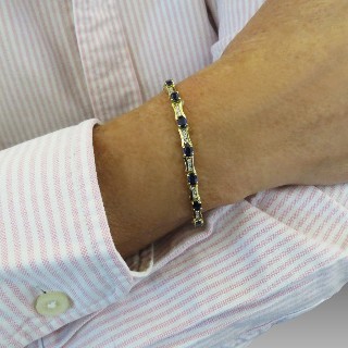 Bracelet articulé en or jaune 18 Cts avec Diamants et Saphirs